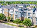 Attractive exterior of townhomes with colorful design elements, small balconies and professionally maintained landscaping at 2551 Statesville Ave, Charlotte, NC 28206