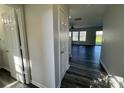 Bright hallway featuring luxury vinyl plank flooring leading to a spacious living area at 2815 Cartesian Dr, Charlotte, NC 28214