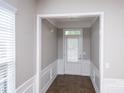 Bright foyer features neutral walls, chair rail molding, and tile flooring at 3040 Azalea Dr, Indian Land, SC 29707