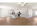 Open-concept kitchen with white cabinets, stainless steel appliances, and an island at 3340 Burberry Dr, Gastonia, NC 28052