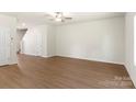 Spacious living room featuring wood-look floors, a ceiling fan, and neutral paint at 3340 Burberry Dr, Gastonia, NC 28052