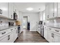 Spacious kitchen with white cabinets, stainless steel appliances, and wood floors at 814 Columbia Dr, Chester, SC 29706