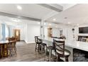Open concept living room with bar, dining table and hardwood floors creates spacious living at 814 Columbia Dr, Chester, SC 29706