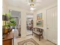 Welcoming foyer with tile flooring, vintage bench, and views to living areas at 916 Cherokee Rd, Charlotte, NC 28207