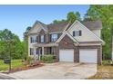 Spacious two-story home featuring a two-car garage and well-maintained lawn at 10836 Maryanna Ct, Charlotte, NC 28213