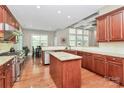 Spacious kitchen featuring granite countertops, wooden cabinetry, and stainless steel appliances at 1105 Hoyle Ln, Waxhaw, NC 28173