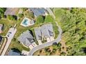Scenic aerial view showcases the home's backyard pool and surrounding landscaping at 1119 21St Ne Ave, Hickory, NC 28601
