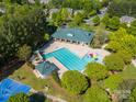 Aerial view of a community pool, featuring a recreational slide and a play area at 12404 Mcallister Park Dr, Charlotte, NC 28277