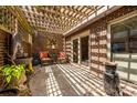 Charming outdoor patio with a fountain, stone accents, and a unique pergola offering dappled sunlight at 217 W 8Th St, Charlotte, NC 28202