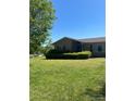A cozy, well-maintained single-story brick home with a lush, green lawn at 28344 Canton Rd, Albemarle, NC 28001