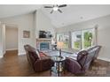 Comfortable living room with stone fireplace, plush seating, and bright windows offers a relaxing atmosphere at 3013 Isle Ln, Monroe, NC 28110
