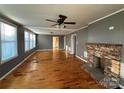 Spacious living room with hardwood floors, brick fireplace, and plenty of natural light at 36 Maple Ave, Gastonia, NC 28054