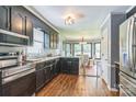Modern kitchen featuring stainless steel appliances, dark cabinetry, and an open layout at 3619 Baywoods Ct, Gastonia, NC 28056
