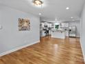 Spacious open-plan kitchen with white cabinetry, stainless steel appliances, and a center island at 4009 Dunwoody Dr, Charlotte, NC 28215