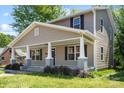 Inviting two-story home featuring a covered porch and manicured front lawn at 543 Hampton St, Rock Hill, SC 29730