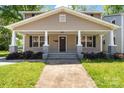 Inviting home exterior showcases a covered front porch with classic columns, landscaped bushes, and a well-manicured lawn at 543 Hampton St, Rock Hill, SC 29730
