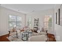 Bright living room with neutral tones, plush seating, and abundant natural light at 642 Vega Nw St, Concord, NC 28027