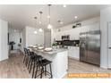 Modern kitchen featuring stainless steel appliances and a granite-topped island with seating at 6455 Honor Ave, Midland, NC 28107