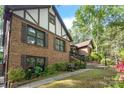 Attractive two-story brick home with shutters, and landscaped garden bed at 6617 Wannamaker Ln, Charlotte, NC 28226