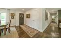 Inviting entryway with hardwood floors, a decorative rug, and stylish front door at 8330 Fallsdale Dr, Charlotte, NC 28214