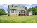 Charming two-story home featuring a welcoming deck and well-maintained lawn at 109 Terrace Pl, Lincolnton, NC 28092