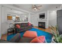 Comfortable living room featuring a fireplace and open access to the kitchen at 11139 Dundarrach Ln, Charlotte, NC 28277