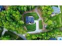 Aerial view of the home nestled on a private lot surrounded by mature trees at 1123 Fern Hill Rd, Mooresville, NC 28117