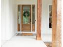 Charming front door with glass and white trim, complemented by a decorative wreath at 1123 Fern Hill Rd, Mooresville, NC 28117