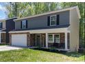 Charming two-story home with stone accents, a welcoming front porch, and a well-manicured lawn at 1336 26Th Ne Ave, Hickory, NC 28601
