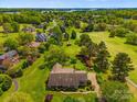 Expansive aerial view of lush property with a beautiful home, golf course, and lake nearby at 189 Billy Jo Rd, Mooresville, NC 28117