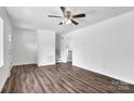 Bright living room featuring new floors, stairs, neutral paint and ceiling fan at 205 Mcgregor Rd, Gastonia, NC 28056