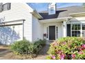Welcoming front entrance with well-kept landscaping, close to the 2-car garage, and a sleek black front door at 2110 Cool Springs Ct, Kannapolis, NC 28083