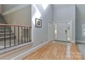 Grand foyer featuring hardwood floors, high ceilings, and staircase at 512 Saint Cloud Dr, Statesville, NC 28625