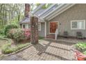 Inviting front entrance with brick walkway and covered portico at 512 Saint Cloud Dr, Statesville, NC 28625