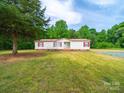 Single story home with lawn in a sunny, wooded setting at 5318 Austin Rd, Monroe, NC 28112