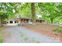 A well maintained brick home with mature trees and detached garage at 7224 Kuck Rd, Mint Hill, NC 28227