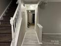 Hallway with stairs, leading to other rooms in the house at 7539 Holly Grove Ct, Charlotte, NC 28227