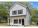 Charming two-story home with white siding, black shutters, and a welcoming front porch at 808 Carolyn Ave, Kannapolis, NC 28083
