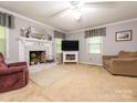 Inviting living room with fireplace, comfortable seating, and neutral decor at 8801 Chinaberry Ln, Concord, NC 28027