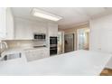 Modern kitchen featuring white cabinets, stainless steel appliances, and quartz countertops at 1000 Rudd Rd, Gastonia, NC 28054