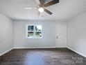 Spacious living area with hardwood floors and ample natural light from the window at 109 Downing St, Troutman, NC 28166