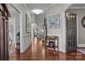 Elegant foyer with hardwood floors, neutral walls, and decorative accents leading into the home at 109 Trent Pines Dr, Mooresville, NC 28117