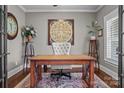 Well-appointed office with a wooden desk, comfortable chair, and sophisticated decor at 109 Trent Pines Dr, Mooresville, NC 28117