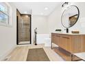 Spa-like bathroom with a modern vanity, walk-in shower, and stand-alone tub at 188 Bailey Rd, Mooresville, NC 28117