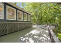 Expansive back deck offers tranquil views of surrounding trees, ideal for relaxation and enjoying the outdoors at 2848 Briar Ridge Dr, Charlotte, NC 28270