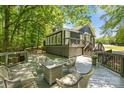Relax on this spacious deck featuring a cozy seating area, perfect for outdoor entertaining and enjoying nature at 2848 Briar Ridge Dr, Charlotte, NC 28270
