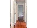 Hallway featuring hardwood floors and white doors leading to other rooms at 302 Kimberlee Dr, Shelby, NC 28152