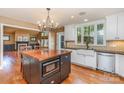 Bright kitchen featuring custom cabinets, hardwood floors and butcher block island at 4467 Woodlark Ln, Charlotte, NC 28211