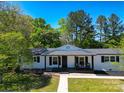 Charming single-story home with a welcoming front porch and freshly painted exterior at 502 Hyde St, Kannapolis, NC 28083