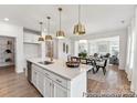 Open-concept kitchen flowing into the dining and living areas, perfect for entertaining at 510 Black Bear St # 145P, China Grove, NC 28023